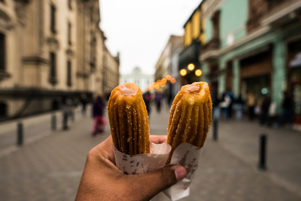 播种的手拿着churros